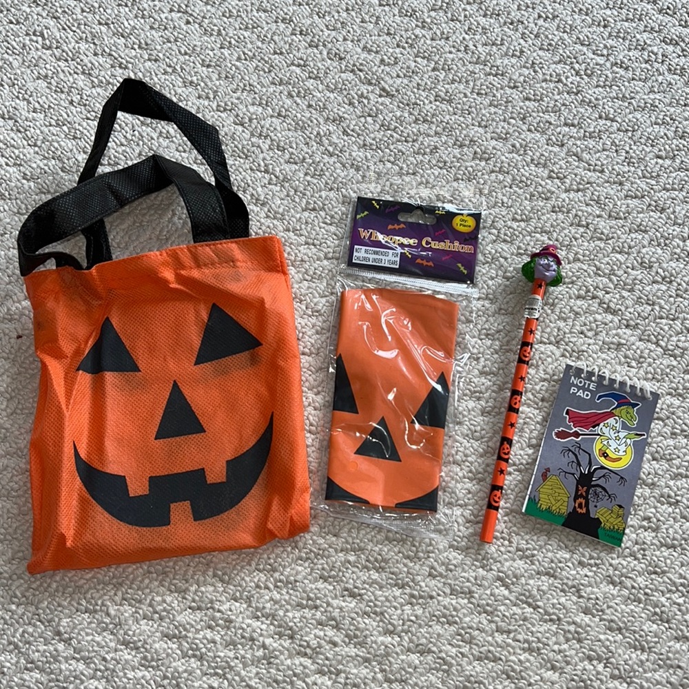 Halloween pumpkin bag, pumpkin whoopee cushion, witch pencil and small notepad